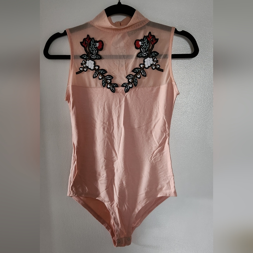 Light pink bodysuit with mesh front, size S